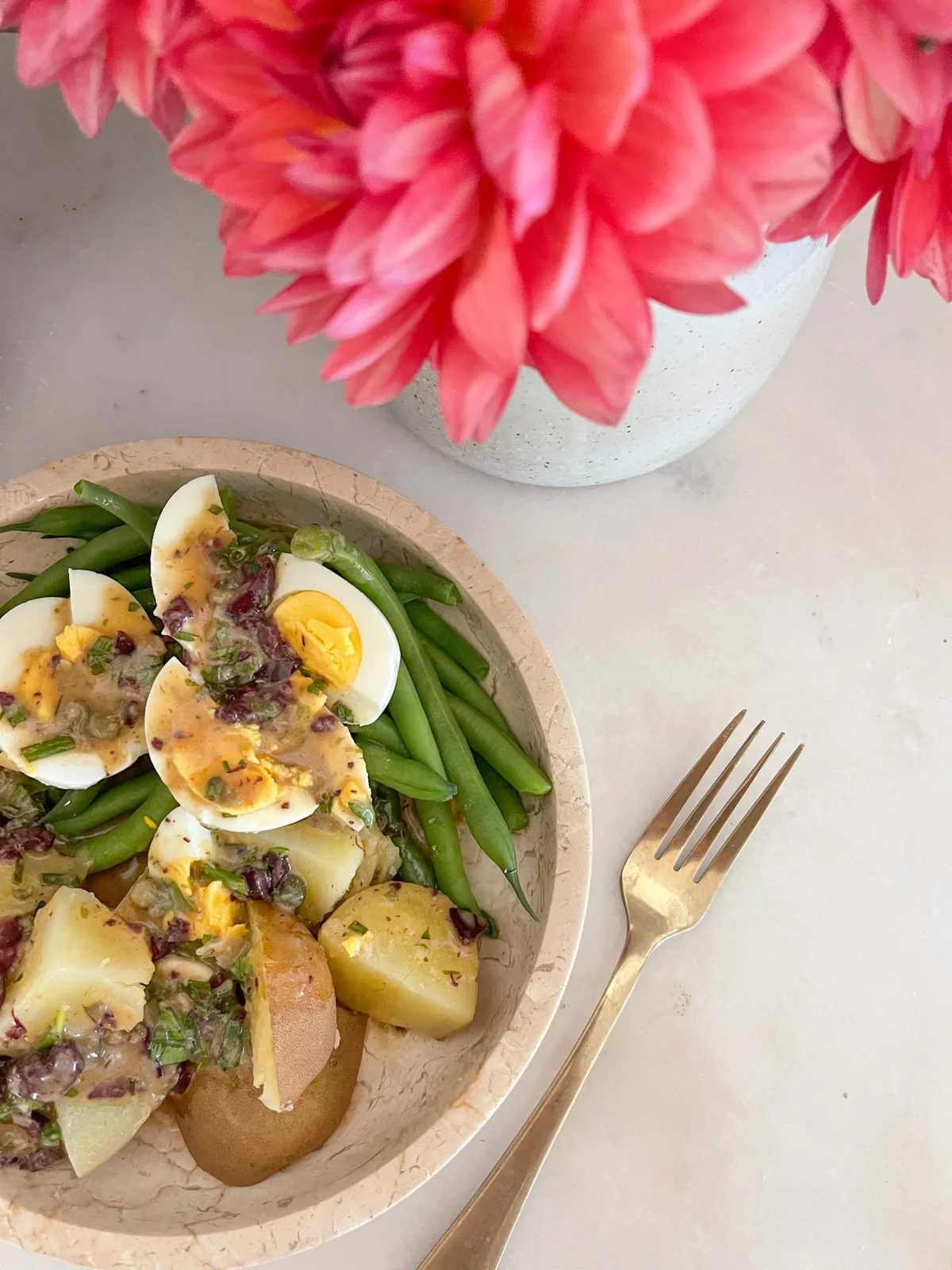 A bowl of eggs, potatoes and vegetables